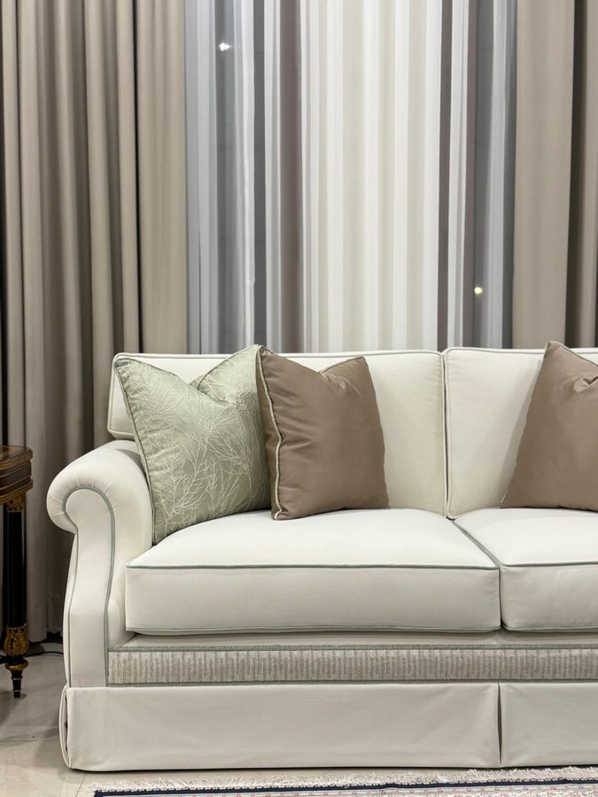 Classic skirted sofa in ivory