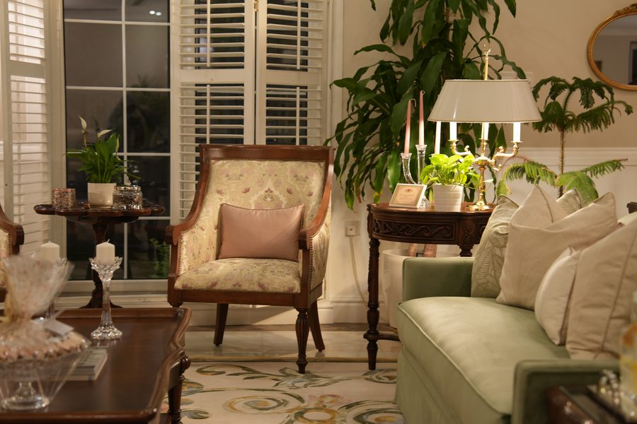 Carved armchair in a sunlit sitting room