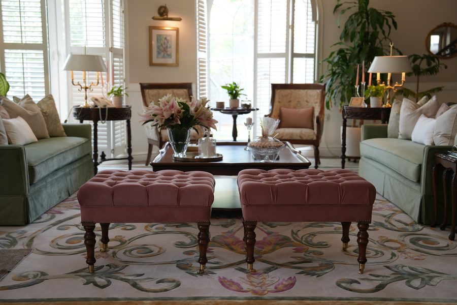 Classic sitting room with tufted ottomans
