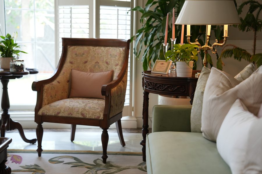 Carved armchair with floral upholstery