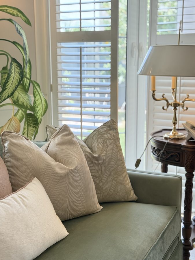 Sage sofa with neutral cushions