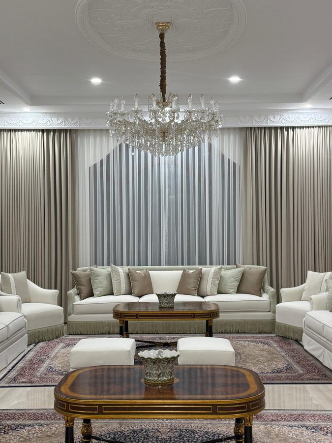 Formal majlis with chandelier and rug