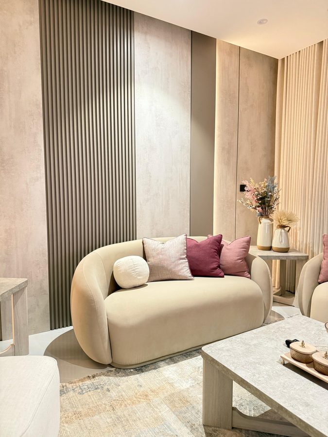 Curved sofa against a fluted wall