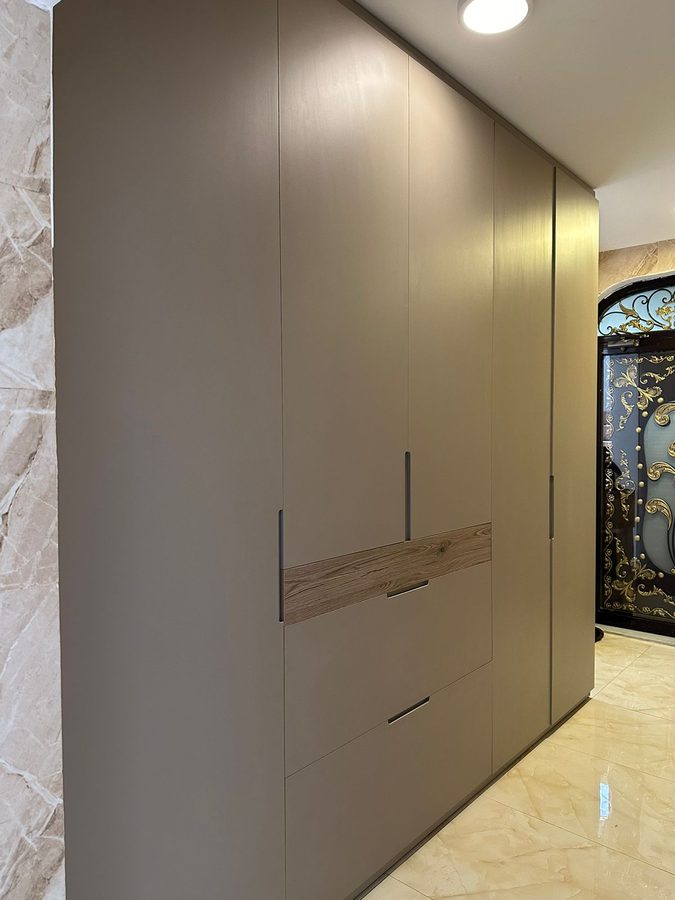 Taupe wardrobe with walnut pulls