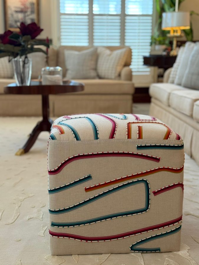 Embroidered pouf in a sitting room