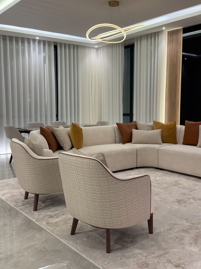 Curved modern majlis with armchairs