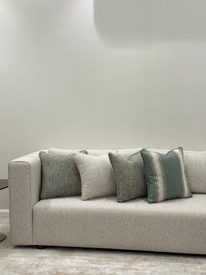 Grey sofa with sage cushions