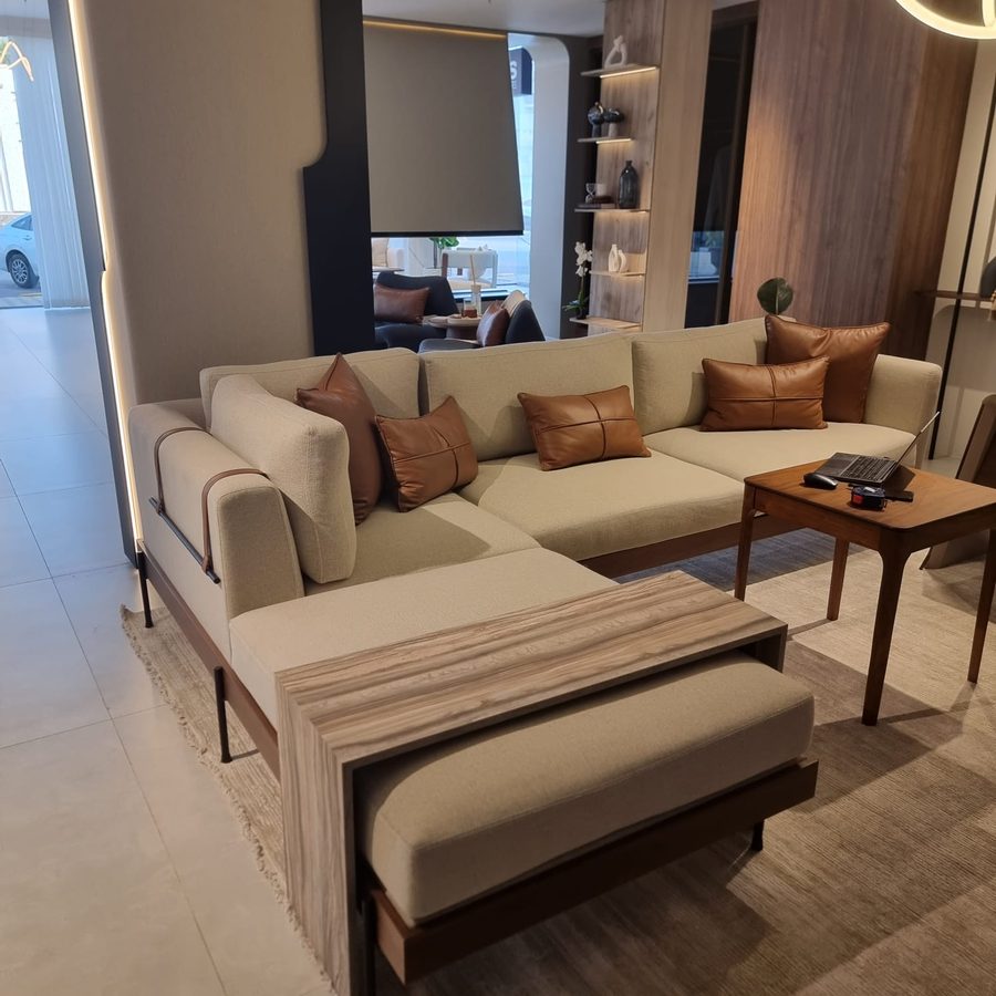 Sofa vignette with leather cushions and a timber bench