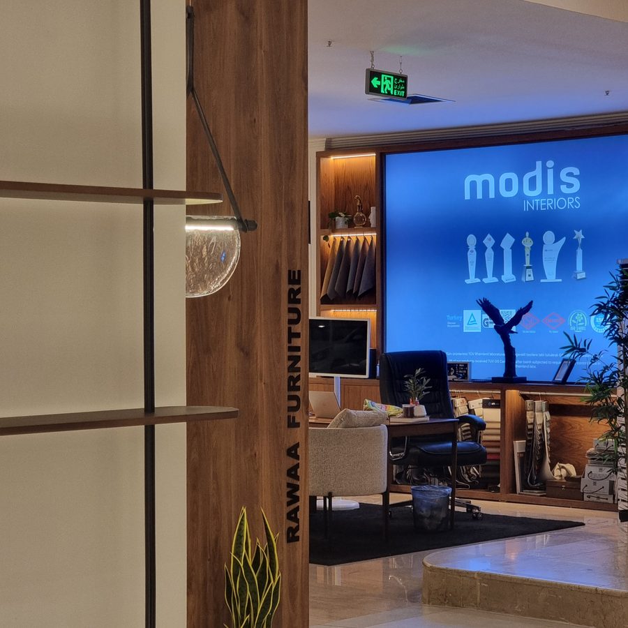 Fabric-wrapped column with Rawaa Furniture lettering