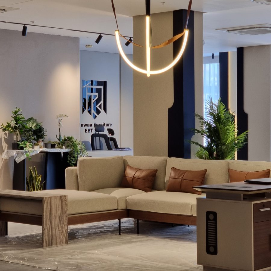 Showroom seating beneath a sculptural pendant