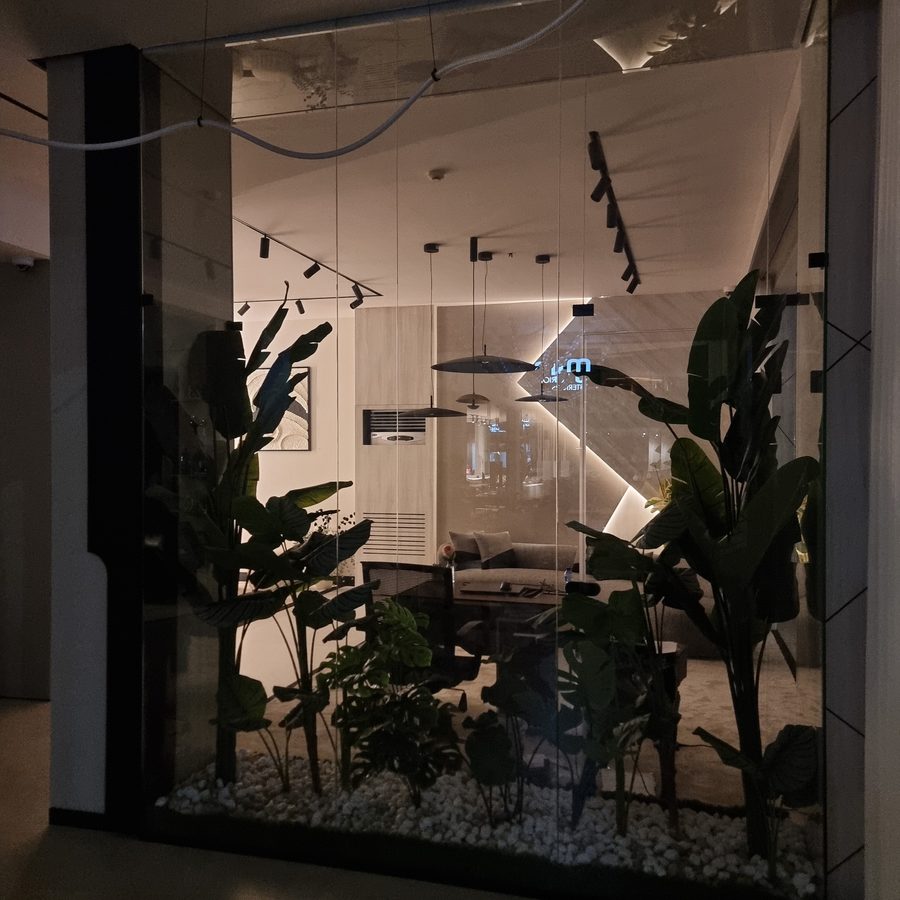 Glass-walled office with planting