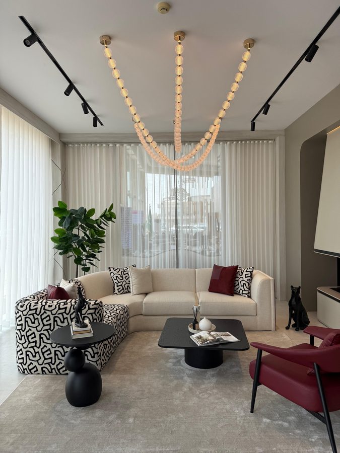 Living vignette under a beaded chandelier