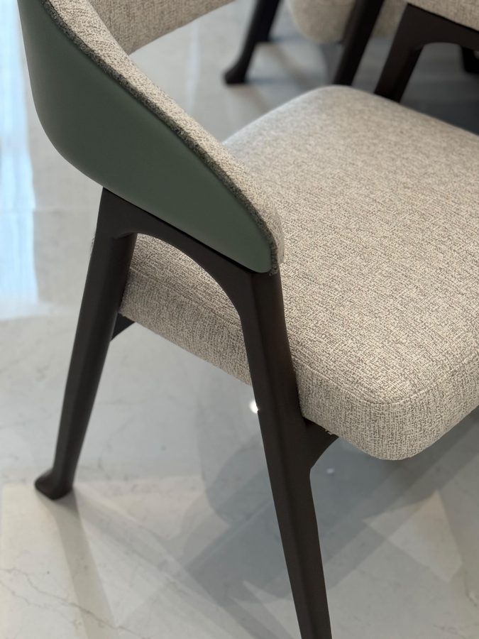 Dining chair in bouclé and walnut with a sage leather back