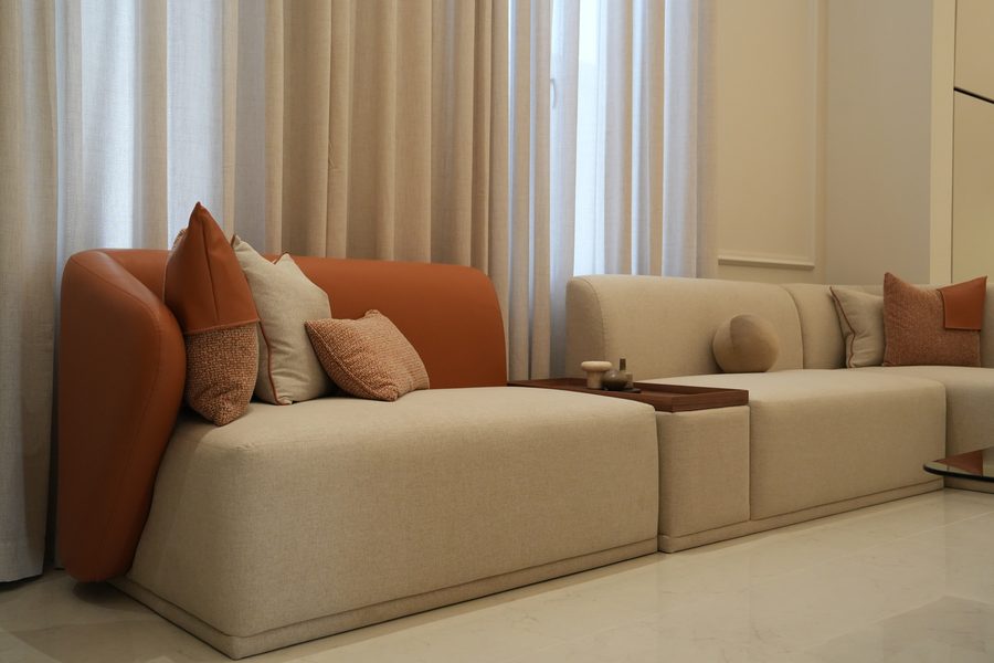 Cream sofa with terracotta cushions